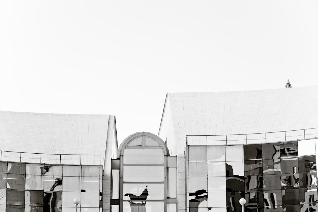 people sitting on chairs near building during daytime