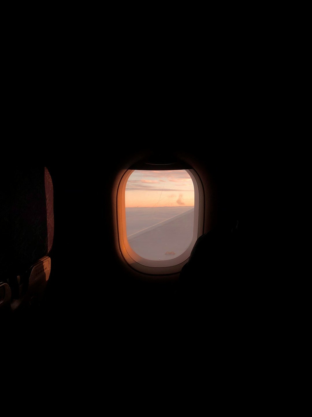 airplane window view of clouds during daytime