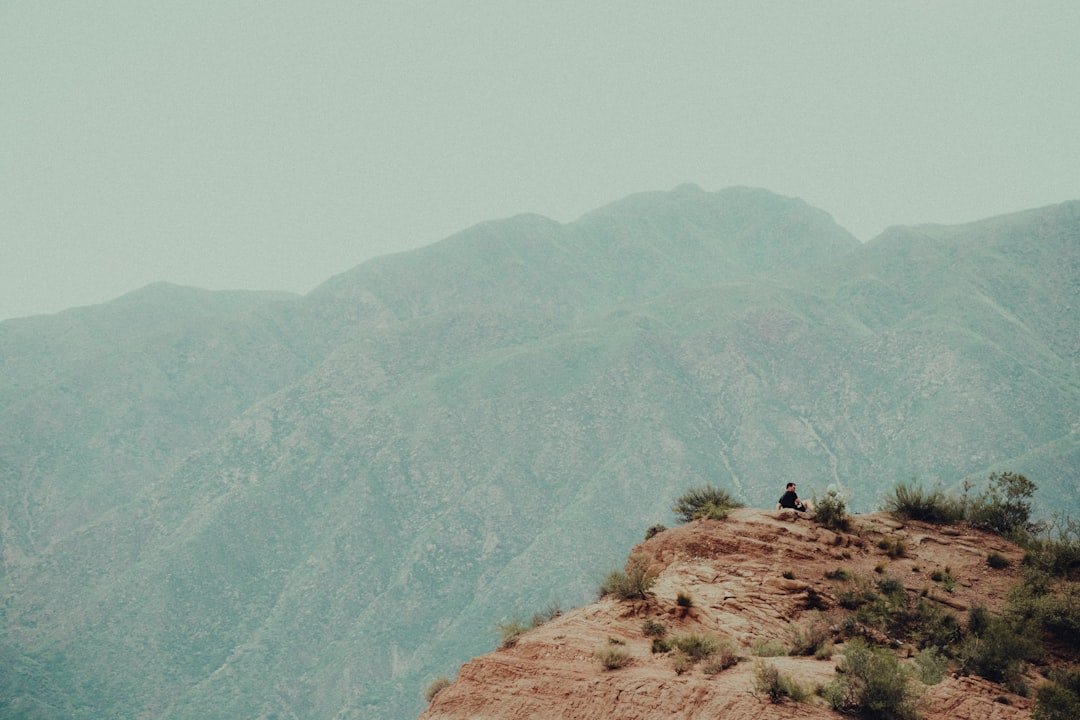 people standing on brown rock mountain during daytime