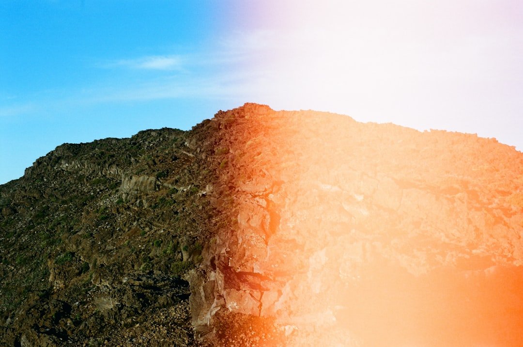 brown mountain under blue sky during daytime