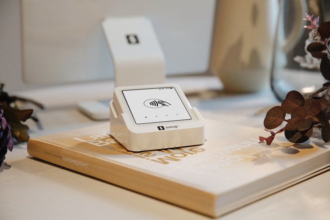 A card reader sits on a book.