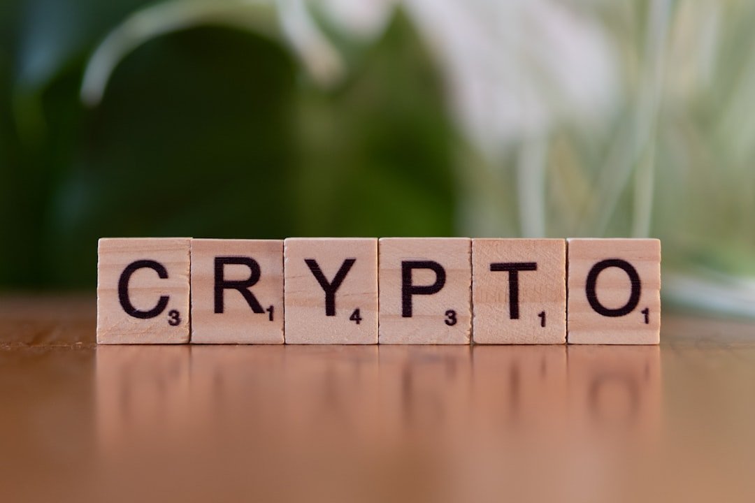 A wooden block spelling crypt on a table