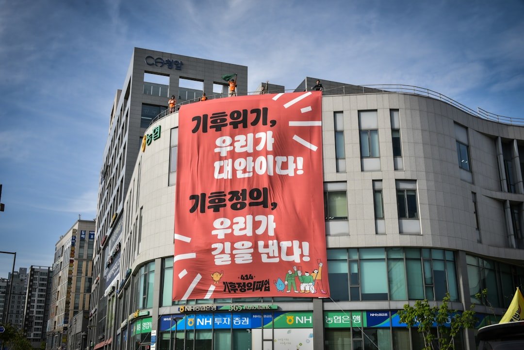 A large red sign on the side of a building
