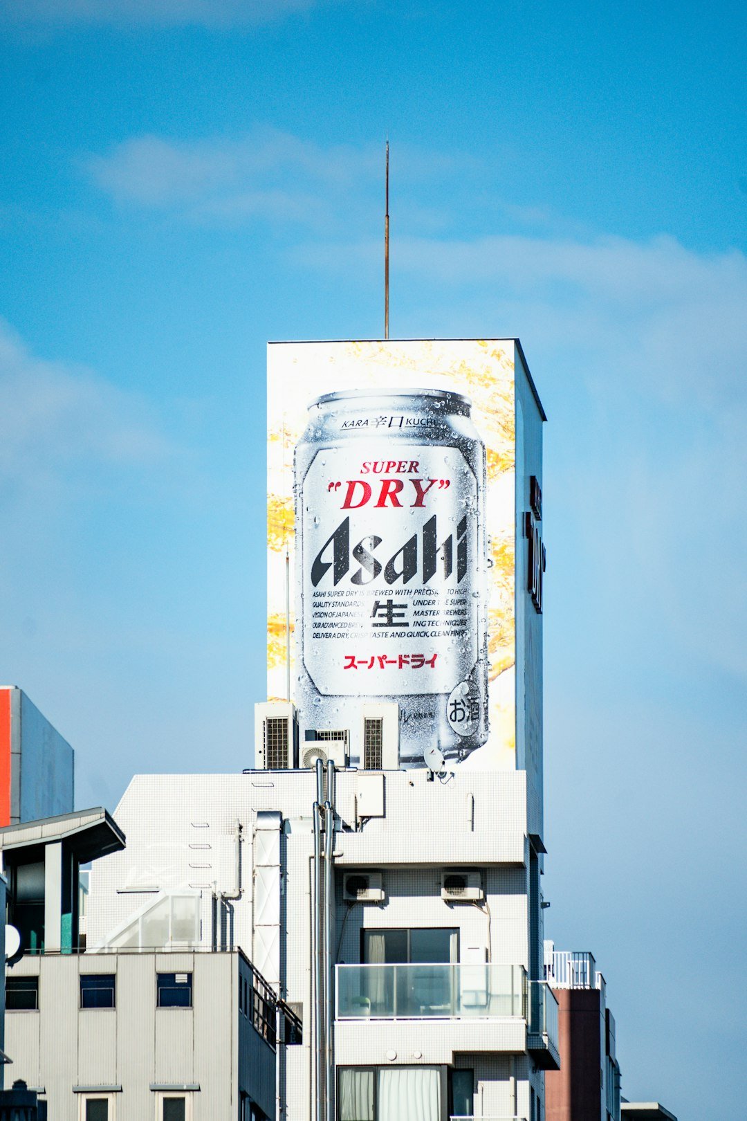 A tall building with a large advertisement on it's side