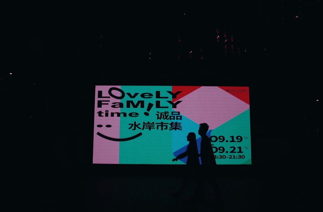 A family event is advertised on a bright screen.